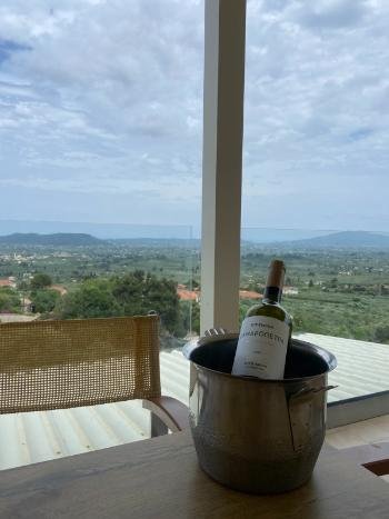 Breathtaking sunset view from the cliffside terrace of Vrahos Taverna